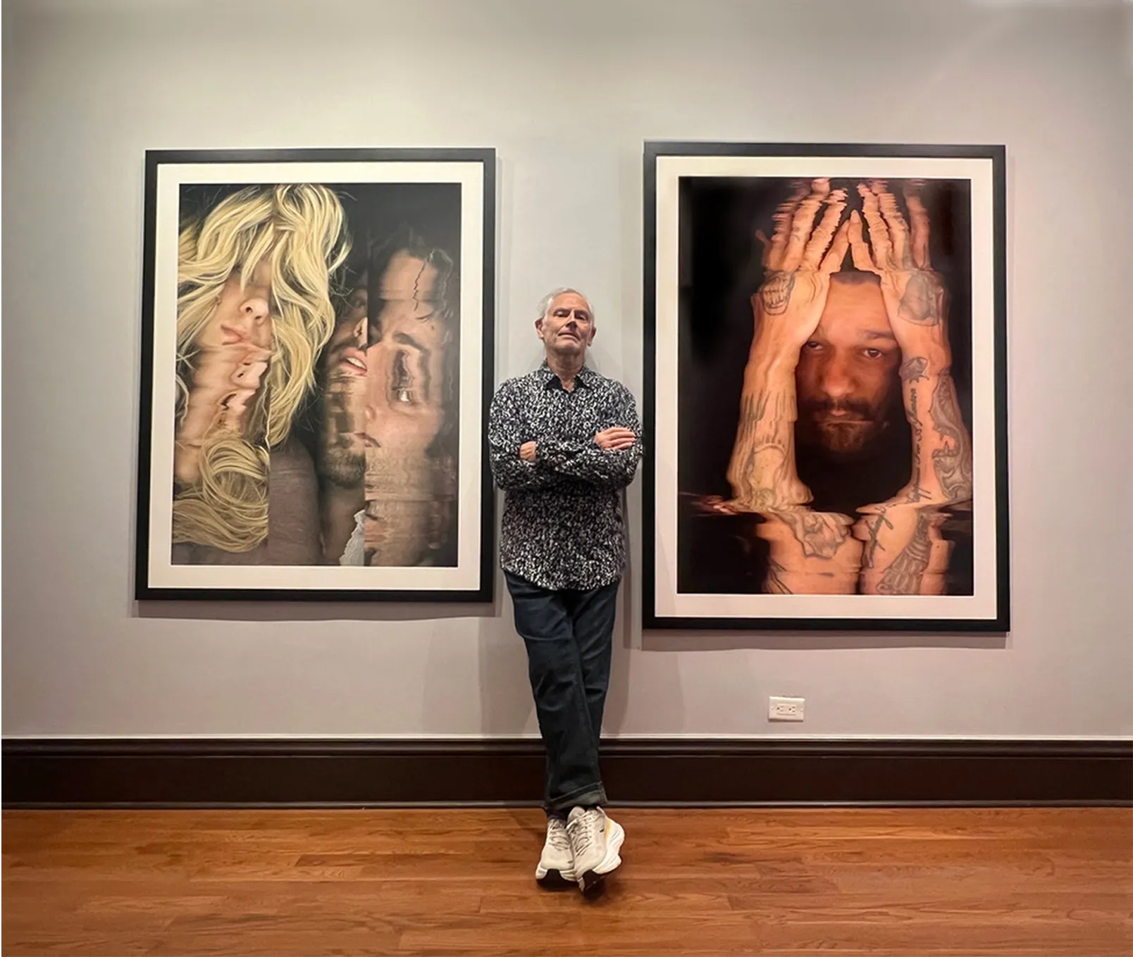 Kurt Novak standing between two framed scanner photographs, D & S and Everything Happens For A Reason